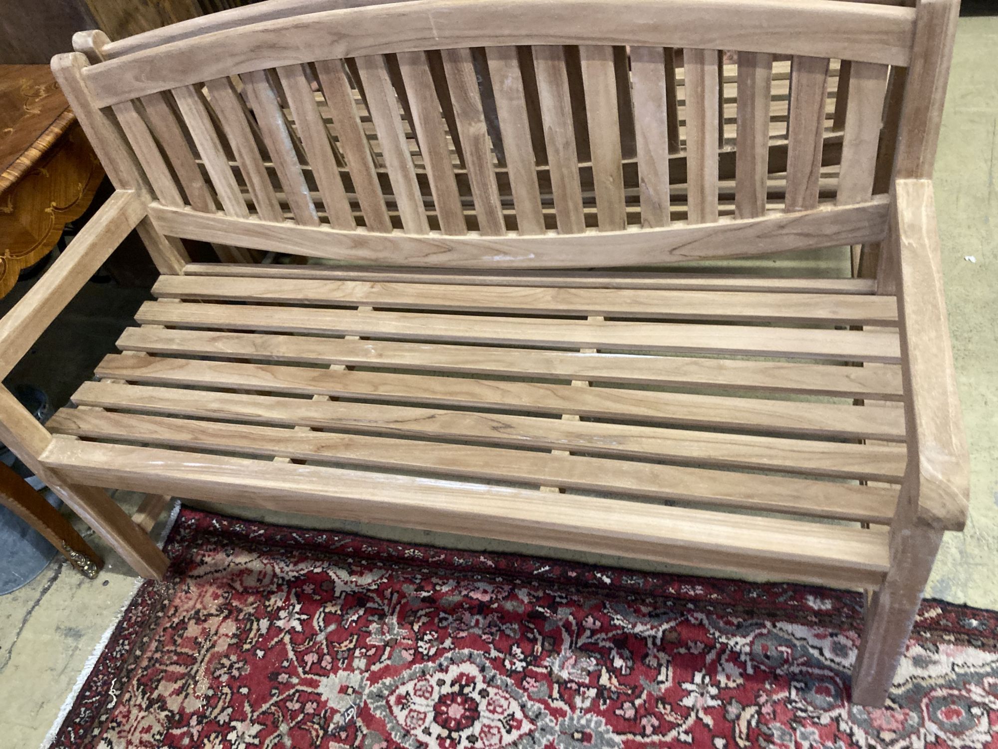 A brand new teak garden bench, length 150cm, depth 62cm, height 92cm